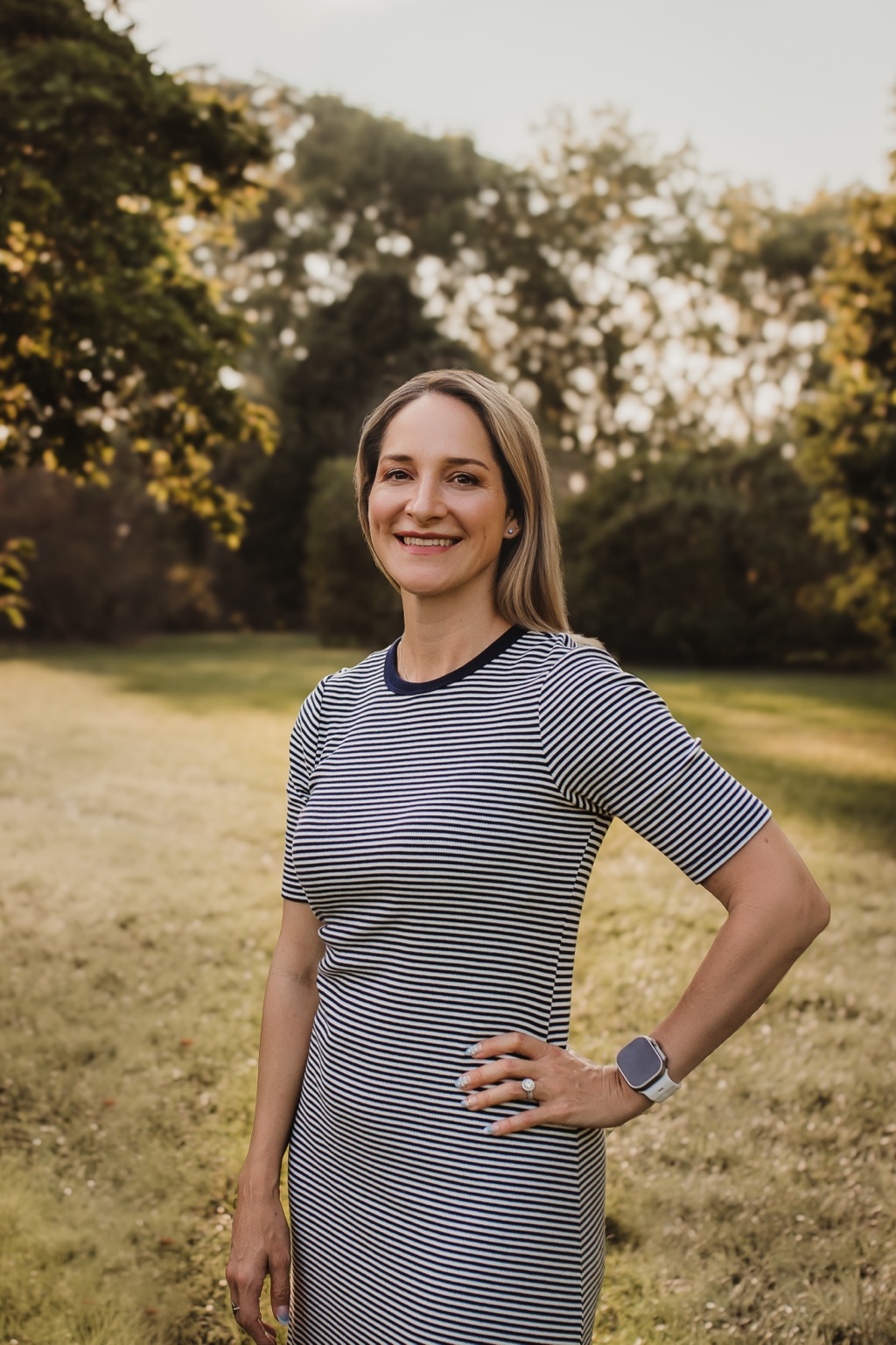 Julianne Flesner smiling outdoors in a natural setting